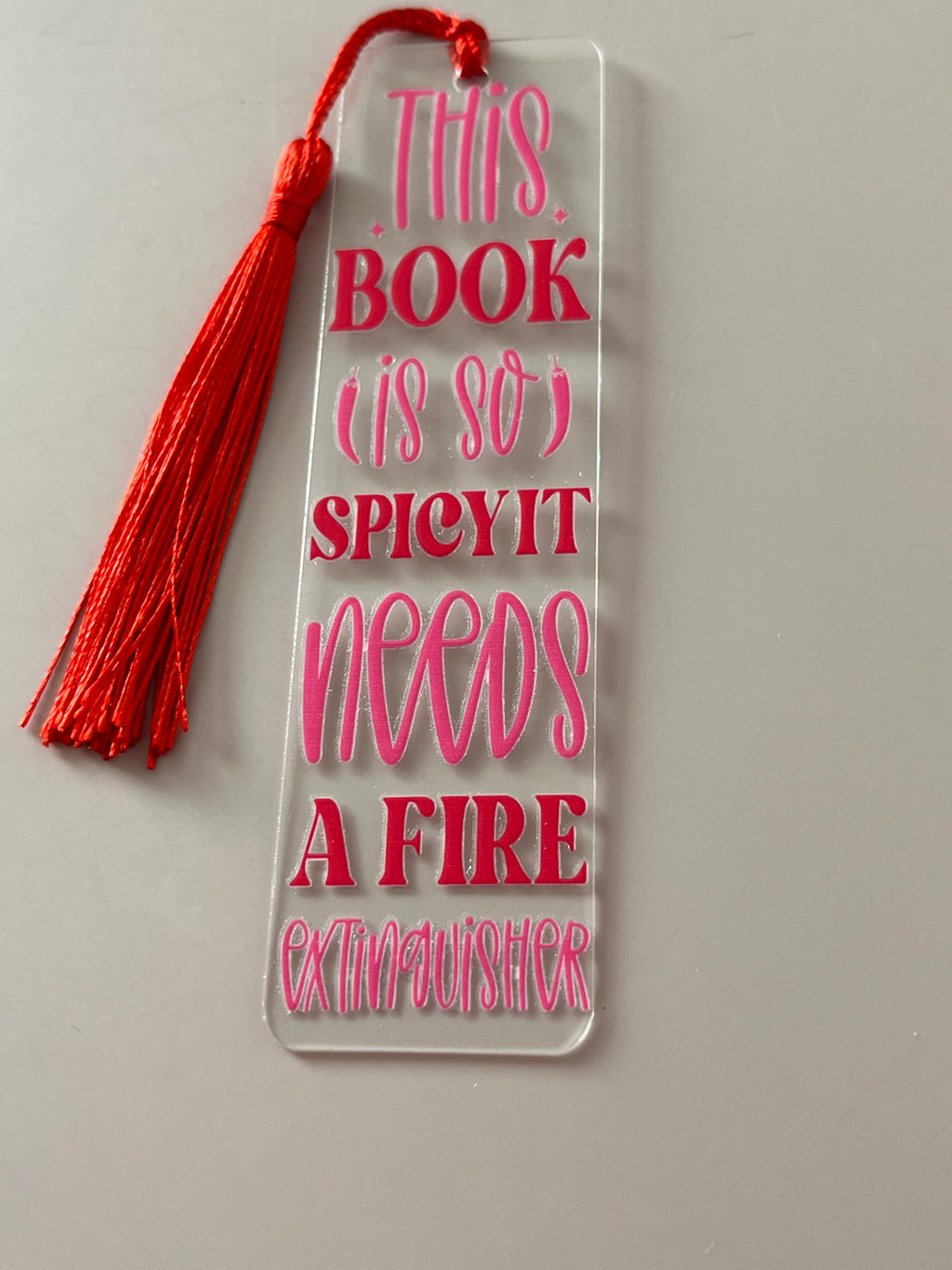 This book is so spicy it needs a fire extinguisher bookmark