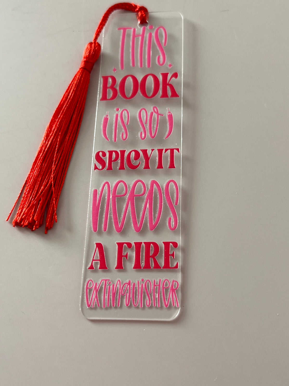 This book is so spicy it needs a fire extinguisher bookmark
